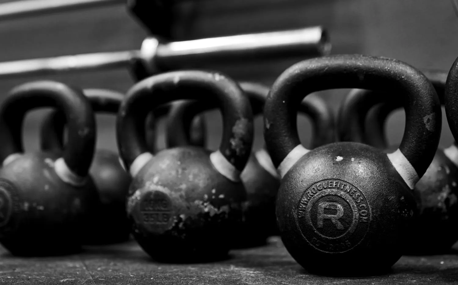 Kettlebells lined up on the training floor